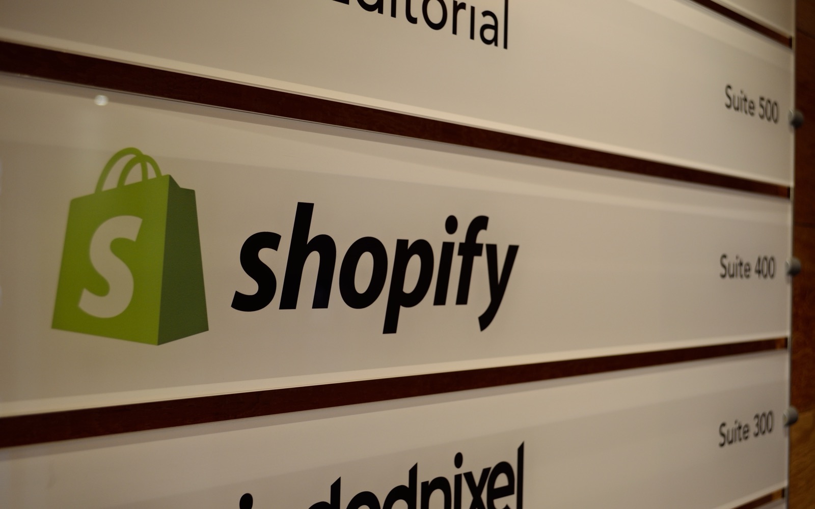 Shopify office signage, illustrating a reported 2026 platform ban on vape sales