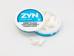 Open tin of ZYN nicotine pouches, used for coverage of FDA modified risk claim orders for specific ZYN products