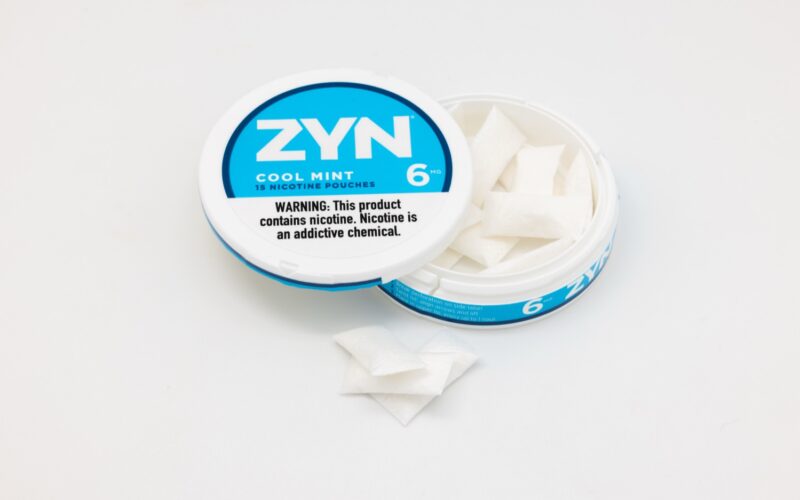 Open tin of ZYN nicotine pouches, used for coverage of FDA modified risk claim orders for specific ZYN products